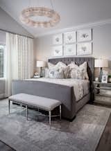 The bed frame is custom from OHM3. The chandelier and nightstands are sourced from Restoration Hardware.  The table lamps is sourced from Curry & Company. The bench is sourced from Bernhardt. The area rug and bedding are sourced from Potterybarn. 