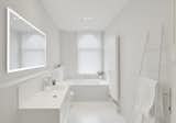 Bath Room, One Piece Toilet, Recessed Lighting, Ceiling Lighting, Wall Mount Sink, Drop In Tub, and Ceramic Tile Floor After: Bathroom 1 - light and bright with a bath under the window  Photo 1 of 12 in White and Pure - Renovation of Two Bathrooms in Brussels by Standing Renovation