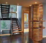 Main Stair with curvilinear cherry wood screen wall