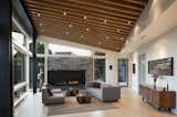 View of living area with exposed fir beams and Danish brick fireplace with bioethanol burner.