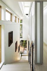 Stair hall is flooded with natural light.