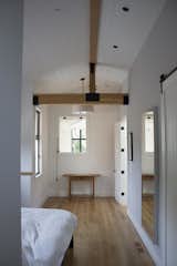 Exposed beams in master suite