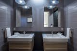 Master bath wall-mounted sinks, tongue-and-groove siding and flush skylight