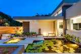 Outdoor, Flowers, Garden, Shrubs, Horizontal Fences, Wall, Wood Fences, Wall, Front Yard, Concrete Patio, Porch, Deck, Concrete Fences, Wall, Planters Patio, Porch, Deck, Hardscapes, Gardens, Walkways, and Landscape Lighting  Photo 7 of 9 in Lotus on Orange by Leader Design Studio