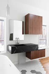 Soapstone bathroom vanity with touch-to-close cabinets