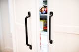Cabinet panels on the refrigerator gives a clean look to an otherwise loud feature.