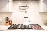 Keep your white backsplash, such as Porcelain and More finish, free of grimy grout lines.