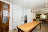 Cabinet panels on the refrigerator give the kitchen a more traditional feel - no loud chrome in this home!