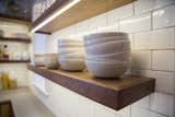 These floating shelves are amazing, we love the idea of using dishes as decor!