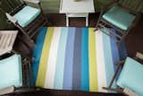 Nothing like a front deck conversation area - this seating area is complimented by a large Pappelina rug in bright colors!