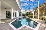 Screened pool, spa & lanai to be enjoyed throughout the seasons  Photo 5 of 6 in A Zen Marco Island Retreat by Elite Living