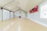 The indoor basketball court is a unique and unexpected room in this home.