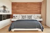 The master bedroom features a wall of teak paneling