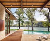 Outdoor, Infinity Pools, Tubs, Shower, Walkways, Hardscapes, Swimming Pools, Tubs, Shower, Back Yard, Trees, Stone Patio, Porch, Deck, Large Pools, Tubs, Shower, and Large Patio, Porch, Deck  Photo 4 of 14 in Lake Austin Residence by A Parallel Architecture