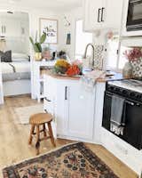 With everything being monocramatic I love to add little pops of color with dish towels and fresh flowers and rugs. 