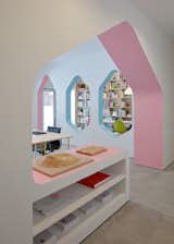 Office, Concrete Floor, Study Room Type, Desk, Chair, and Storage 24d-studio main studio space with extruded pink arch that functions as display and storage niche  Photo 6 of 22 in House Of Many Arches by Marina Topunova