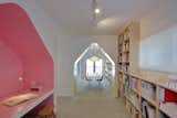 Office, Concrete Floor, Library Room Type, Storage, Lamps, Desk, Bookcase, and Chair 24d-studio library with birch plywood built-in shelves and study nook  Photo 9 of 22 in House Of Many Arches by Marina Topunova