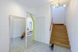 24d-studio residential foyer with wide oak stairway