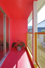 Outdoor, Metal Fences, Wall, and Small Patio, Porch, Deck 24d-studio 2nd floor magenta colored north balcony  Photo 20 of 22 in House Of Many Arches by Marina Topunova