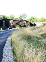 Windswept prairie grass maintains a clean boarder and helps to prevent storm water run off with a chip stone edge.  