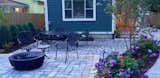 Blending colors in the hardscape accentuate the  changes in elevation in this Birmingham Michigan backyard. 