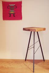 Custom counter stools by Workshop-25 and Oaxacan textiles add a bit of angular fun to the kitchen.