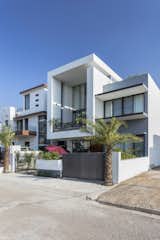 The 11 feet cantilevered block, emphasizing its prominence in the front façade, serves for a double-height semi-open space. 