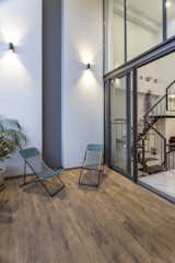 Casual seating in the double height front terrace.