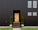 Exterior, Metal Roof Material, Metal Siding Material, Gable RoofLine, and House Building Type close up of entry door  Photo 3 of 4 in Michigan Black House by A.LANE architecture