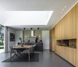 Kitchen, Concrete Floor, Wall Oven, Wood Cabinet, Wall Lighting, Ceiling Lighting, and Metal Counter  Photos from Villa IJsselzig
