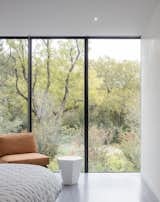 Within each bedroom, the architecture acts as a frame to the landscape beyond. The opening picture faces east towards the land and water conservation project across the street; it is 10' h x 15' w.