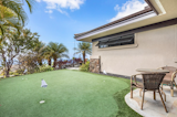 Putting green by Southwest Greens allows you to practice right at home.  Photo 16 of 16 in Hawaii Architect's Home in Keauhou Estates by Brittany Anderson