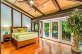 Guest bedroom is flooded with light providing a tranquil ambiance 