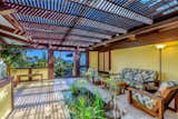 Dramatic covered entryway with koi pond