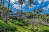 The private estate rests on a gated 1.7-acre hillside parcel