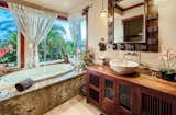 Spa-like bathroom  Photo 11 of 13 in Majestic Maui Estate by Brittany Anderson