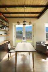 Dining Room, Chair, Accent Lighting, Table, Concrete Floor, Pendant Lighting, and Ceiling Lighting Dining Room, local wood and sustainable materials.  Photo 5 of 15 in Modern Vermont Farmhouse by Lindsay Selin Photography