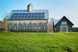 Outdoor, Grass, and Side Yard Woodshop barn, with solar array, Southern facade  Photo 14 of 15 in Modern Vermont Farmhouse by Lindsay Selin Photography