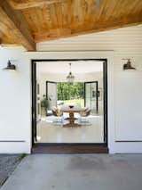 Outside-inside dining room, with a touch of scandinavian furniture design. 