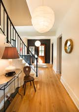 Hallway, Medium Hardwood Floor, and Light Hardwood Floor Entry Hall  Photo 12 of 22 in Contemporary Vermont Farmhouse by Lindsay Selin Photography