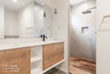 Bath Room, Pendant Lighting, Ceiling Lighting, Concrete Floor, Open Shower, and Concrete Wall  Photo 10 of 14 in Traxler 1 by BLOM Design Studio