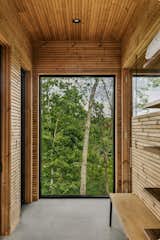 We used thermotreated wood cladding for both exteriors and interiors of this Finnish steam sauna with an amazing views of mountains and Lake Keowee.