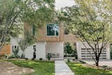 The material & color palette of this home is very minimal but inviting, limited to stucco and thermotreated wood cladding on the exterior and warm white paint colors, white oak, and aluminum windows and doors.
