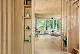Built in white oak nook / drop zone shelving for the main entry of this home, that was designed so every item would have its designated space
