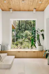 Home office, library and playroom all in one space, stepped down a couple of steps from the main livign space. Built in window seat facing a xeroscape garden with plenty of storage drawers underneath to hide all the toys