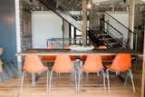 Dining- the clients entertain a lot, her husband custom built this dining table that can extend up to 18' long, and Mindy has over 30 Eames molded fiberglass chairs!