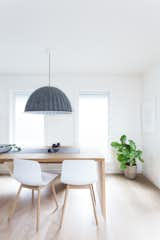 Dining Room, Pendant Lighting, Bench, Chair, Table, and Light Hardwood Floor  Photos from The Kylo House