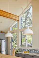 The new kitchen was vaulted to bring in plentiful light and take in views of the magnificent oak tree in the back. 