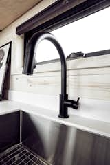 Large, stainless under-mounted sink makes real cooking and cleaning as easy as it is in a typical house.