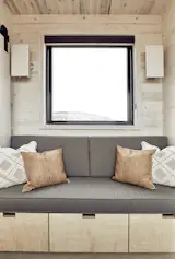 Custom sconces, couch and storage.